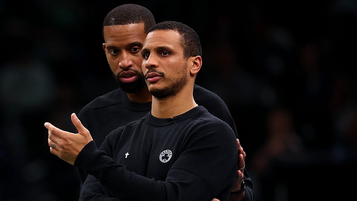 Boston Celtics assistant coach Charles Lee (left) and head coach Joe Mazzulla confer during a game on Nov. 23, 2023. - null