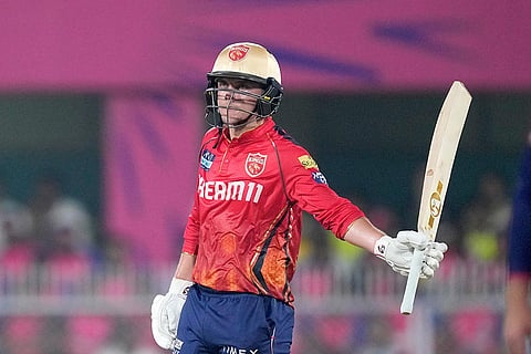 Punjab Kings' Sam Curran celebrates scoring fifty runs