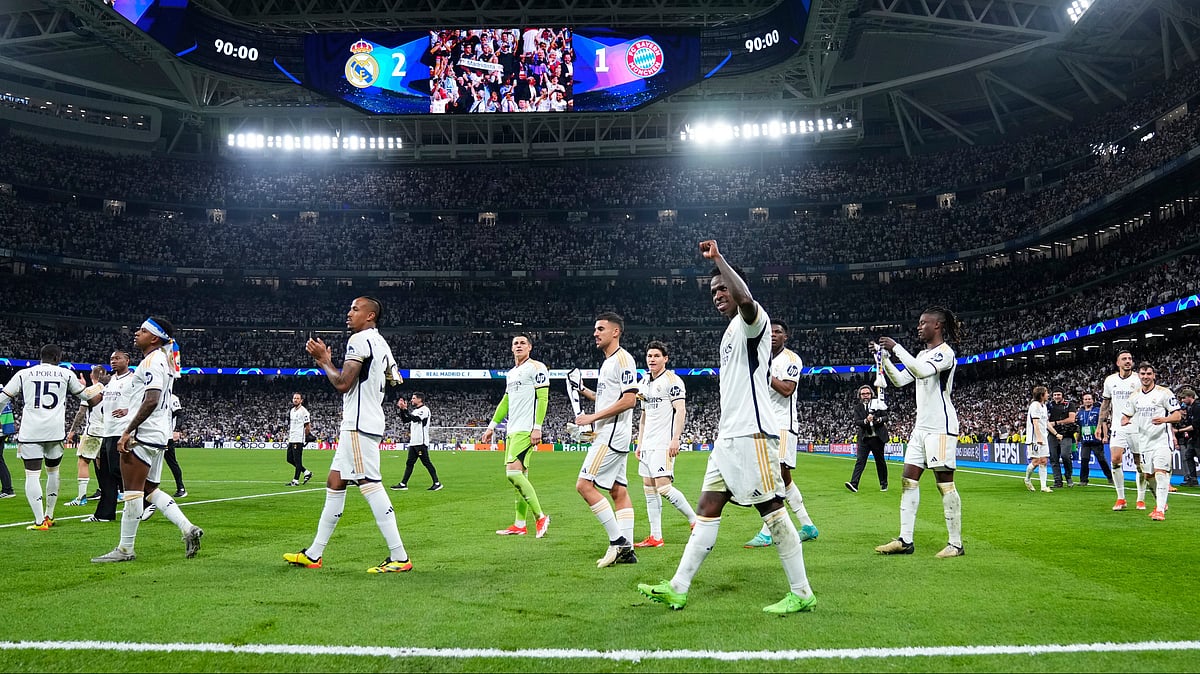 AP : Real Madrid players celebrate at the end of the Champions League semifinal second leg soccer match between Real Madrid and Bayern Munich. 
