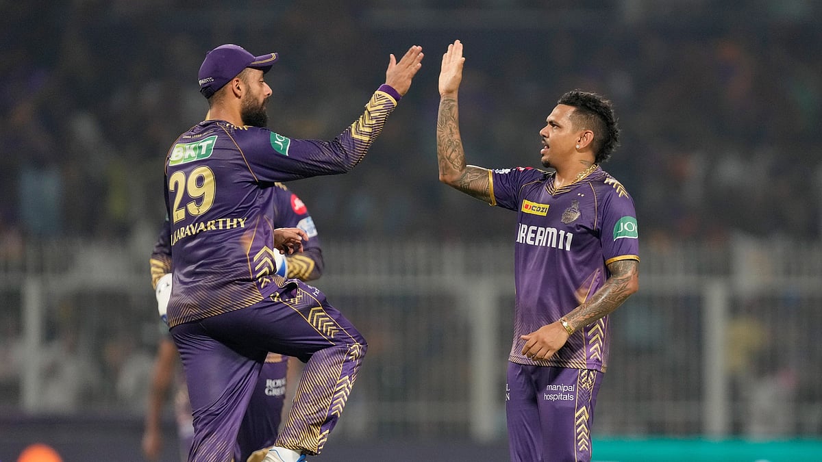 Kolkata Knight Riders' Sunil Narine celebrates the wicket of Delhi Capitals' Axar Patel with teammates during the Indian Premier League cricket match between Delhi Capitals and Kolkata Knight Riders in Kolkata. - AP Photo/Bikas Das