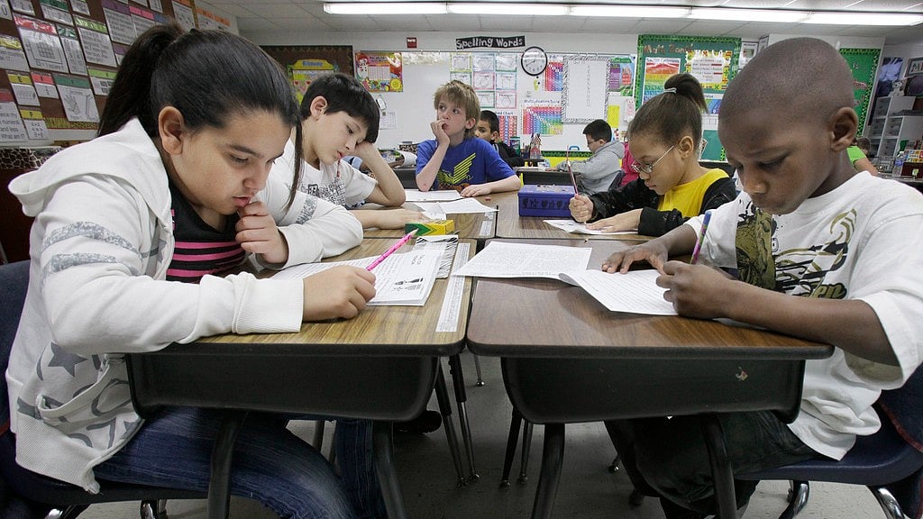 AP : Third-grade students do school work during class at Hanby Elementary School, Feb. 15, 2011, in Mesquite, Texas. 