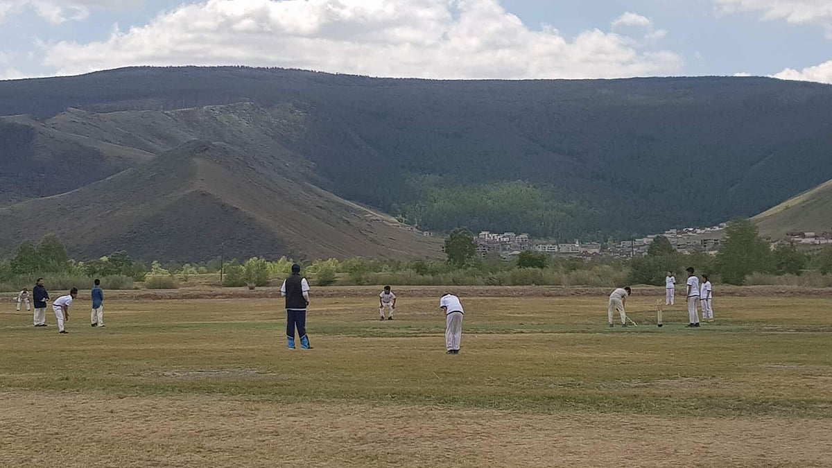 Young Mongolian kids play a cricket match. - Cricket Mongolia