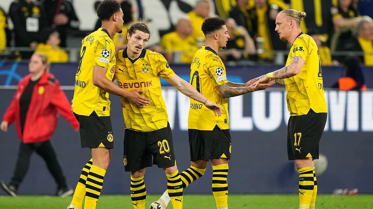 Borussia Dortmund's players celebrate after the Champions League semifinal first leg soccer match where they defeated Paris Saint-Germain to clinch their spot in the finals.  - AP