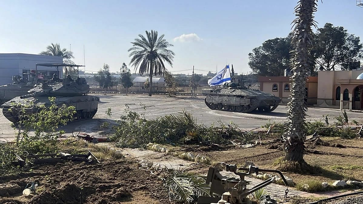 An Israeli tank entering the Gaza's Rafah border - AP