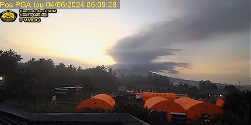 AP : Indonesia's Mount Ibu spewed red lava and thick grey ash clouds that towered 5,000 meters |