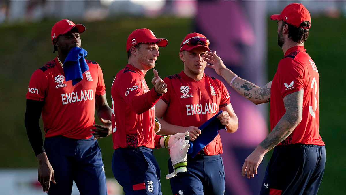 England's captain Jos Buttler, second left, celebrates with teammates winning an ICC Men's T20 World Cup cricket match against Namibia at Siv Vivian Richards Stadium in North Sound, Antigua and Barbuda. - AP Photo/Ricardo Mazalan