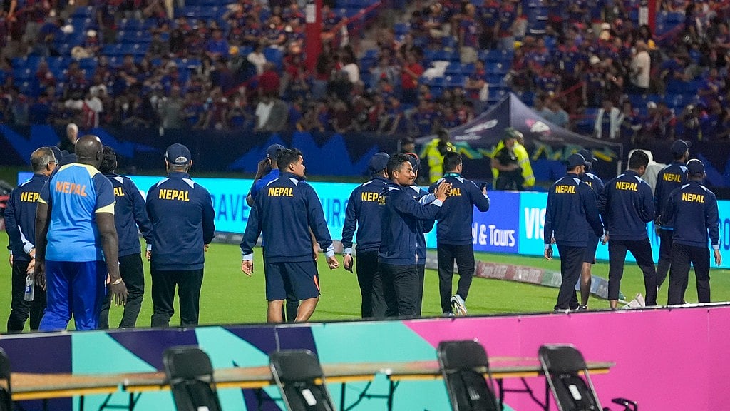 AP/Lynne Sladky : Nepal players walk around the field and gesture to fans after their men's ICC T20 World Cup 2024 match against Sri Lanka was abandoned due to rain at Central Broward Regional Park Stadium in Lauderhill, Florida on Wednesday (June 12).