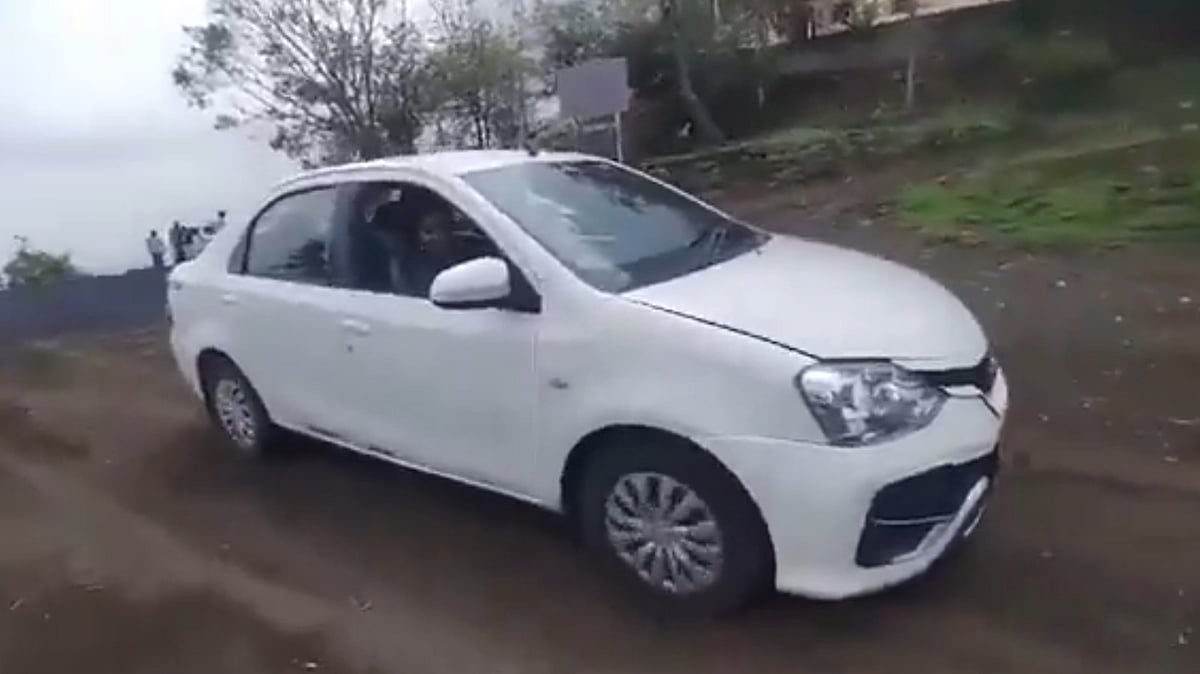 X : A woman reverses her car into a deep cliff and dies in Maharashtra.