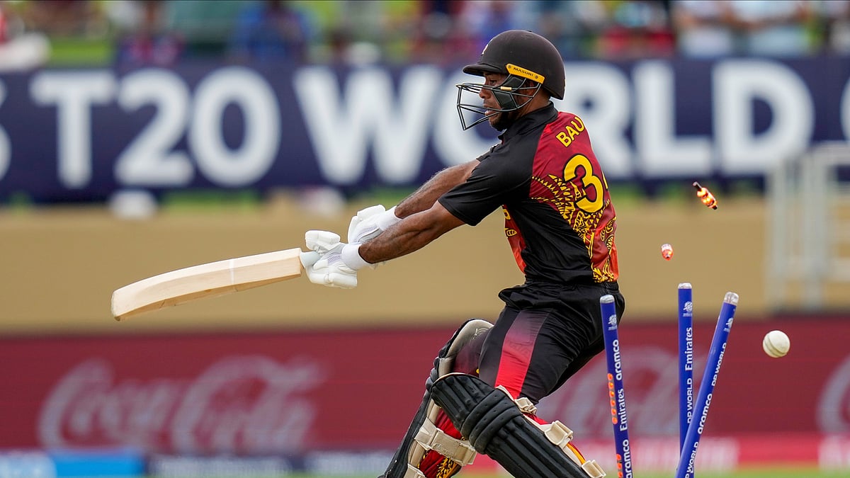 (AP Photo/Ramon Espinosa) : Papua New Guinea's Sese Bau is bowled by West Indies' Alzarri Joseph during an ICC Men's T20 World Cup cricket match at Guyana National Stadium in Providence, Guyana, Sunday, June 2, 2024. 
