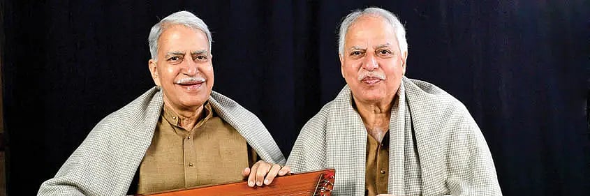 X : Sajan Mishra with his late brother Rajan Mishra