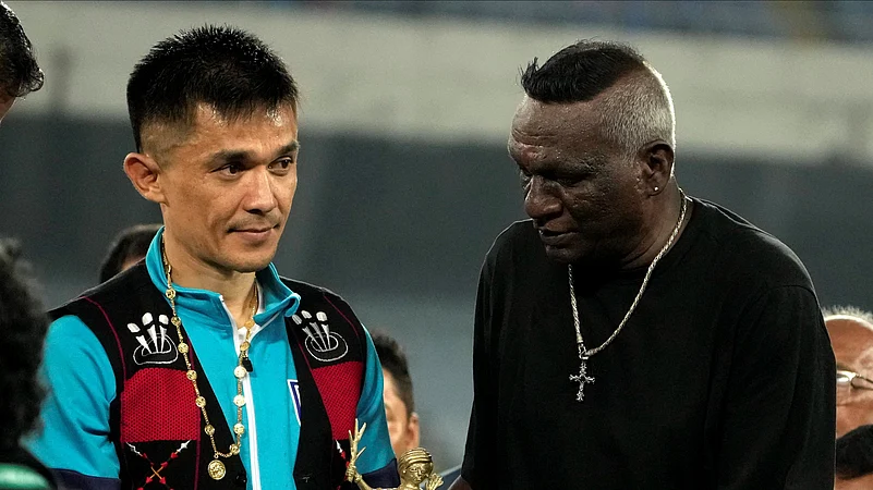 Indias captain Sunil Chhetri is being felicitated by former Indian footballer IM Vijayan as he retires from international football. PTI Photo