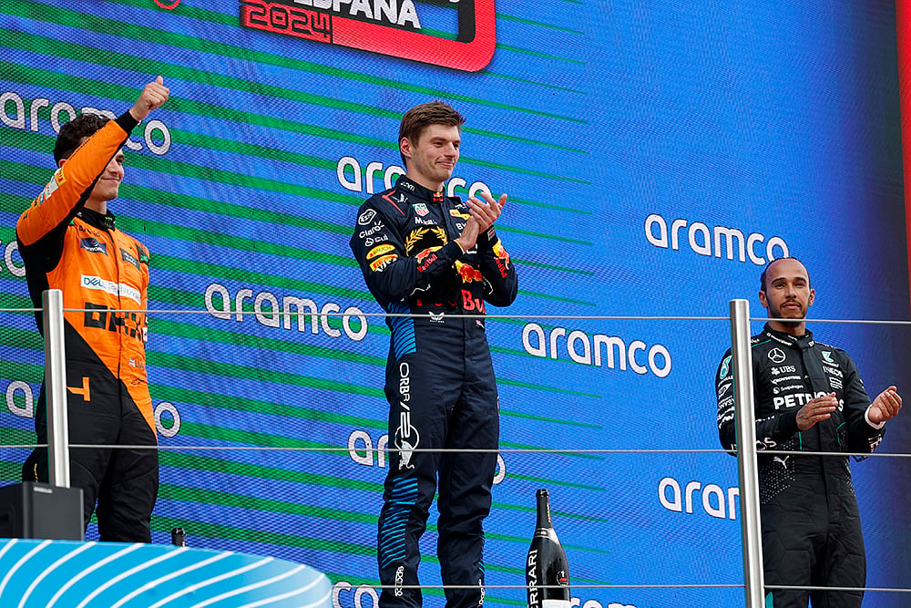 | Photo: AP/Joan Monfort : Winner Max Verstappen with Lando Norris and Lewis Hamilton