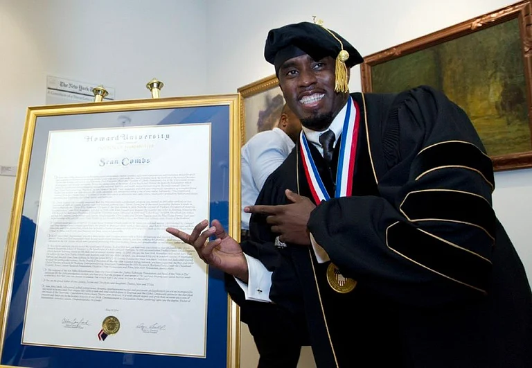 Sean "Diddy" Combs with his honorary degree awarded by Howard University in 2014. - X