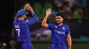 X/Afghanistan Cricket Board : Fazalhaq Farooqi (right) is the leading wicket-taker at the ICC T20 World Cup 2024.
