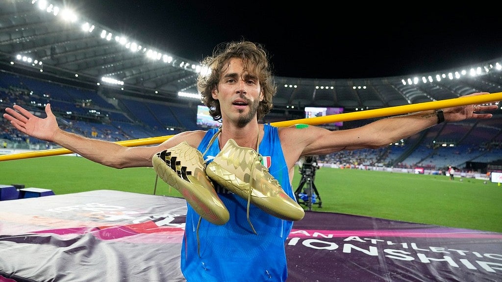 AP : Gianmarco Tamberi, of Italy, poses after winning the gold medal in the men's high jump final at the European Athletics Championships in Rome, Tuesday, June 11, 2024.