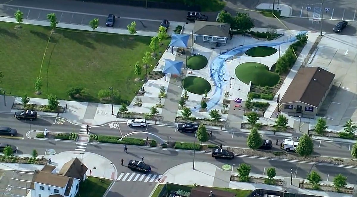 AP : Police respond to the scene of a shooting at the Brooklands Plaza Splash Pad.