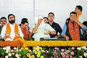 Photo: Getty Images : Feeling the Heat: Eknath Shinde, PM Narendra Modi and Devendra Fadnavis at a rally in Mumbai during the elections