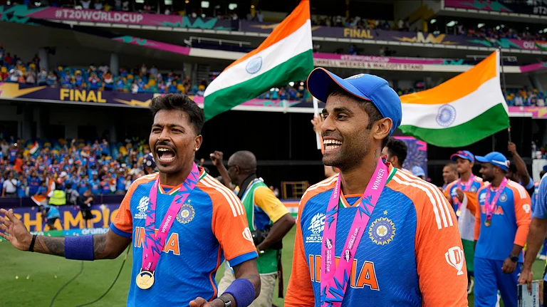 India's Hardik Pandya, left, and teammate Suryakumar Yadav celebrate after India won the ICC Men's T20 World Cup final cricket match against South Africa at Kensington Oval in Bridgetown, Barbados. - AP Photo/Ramon Espinosa
