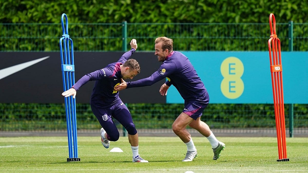England's Harry Kane, right, and Kieran Trippier duringa training session at the Tottenham Hotspur Training Session, London, Thursday June 6, 2024.  - (Zac Goodwin/PA via AP)
