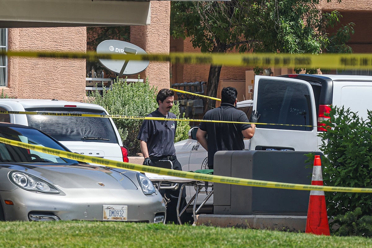 AP : North Las Vegas Police investigate the scene of Monday night's shooting at an apartment complex in North Las Vegas, Tuesday, June 25