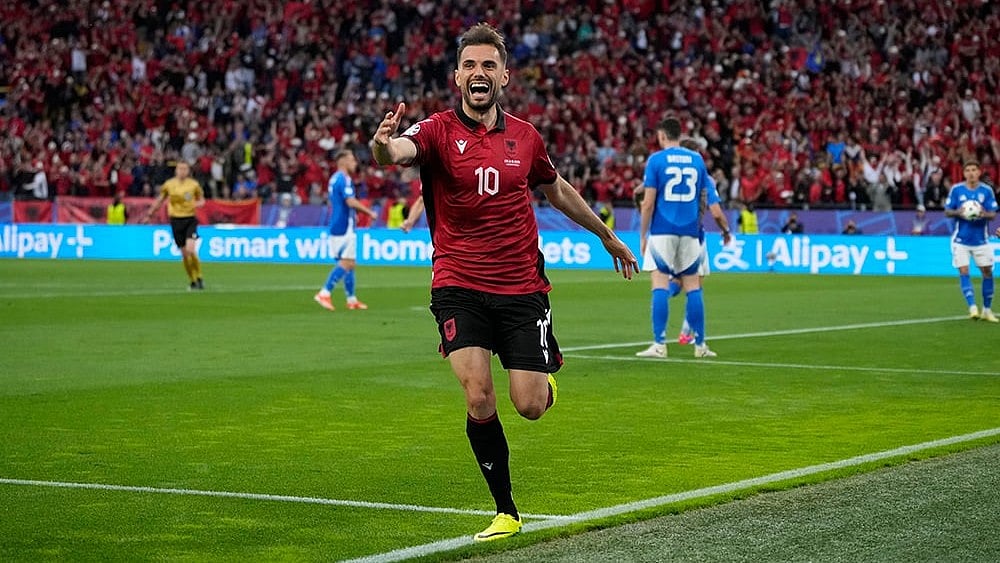 | Photo: AP/Alessandra Tarantino : Nedim Bajrami celebrates after scoring a goal