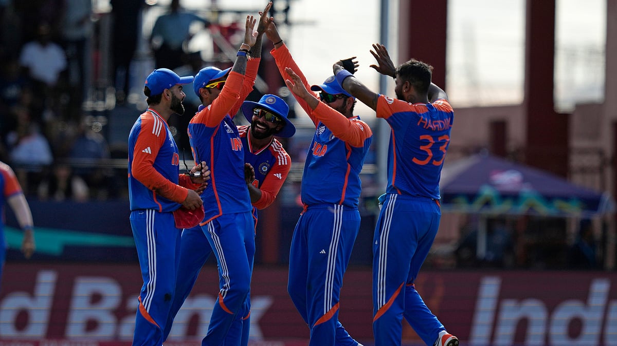 Indian players celebrate during the ICC Men's T20 World Cup second semifinal cricket match between England and India at the Guyana National Stadium in Providence, Guyana, Thursday, June 27, 2024. 
 - (AP Photo/Ramon Espinosa)