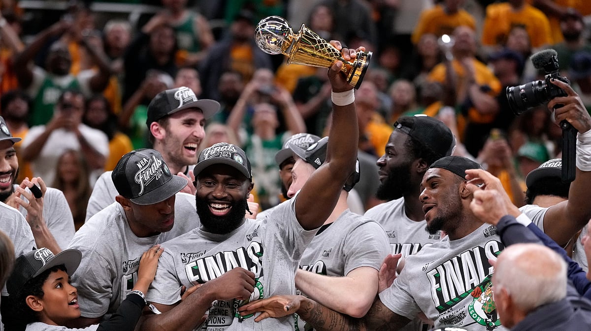 (AP Photo/Michael Conroy) : Boston Celtics guard Jaylen Brown, center, celebrates with his teammates after Game 4 of the NBA Eastern Conference basketball finals against the Indiana Pacers, Monday, May 27, 2024, in Indianapolis. The Celtics won 105-102.