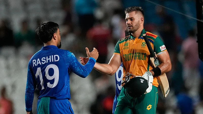 Rashid Khan and Aiden Markram shake hands, AFG vs SA semifinal, T20 World Cup 2024, AP photo