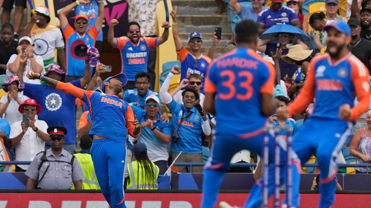AP Photo/Ramon Espinosa : India's Suryakumar Yadav, left, takes the catch to get South Africa's David Miller out as teammates Virat Kohli, right, and Hardik Pandya celebrate during the ICC Men's T20 World Cup final cricket match between India and South Africa at Kensington Oval in Bridgetown, Barbados.