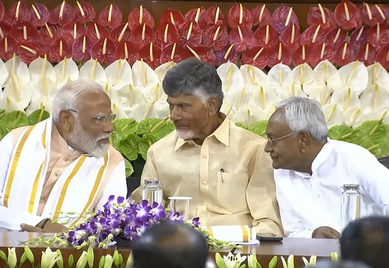 PM Narendra Modi with TDP chief Chandrababu Naidu and JD(U) chief Nitish Kumar at the old parliament building - File Photo