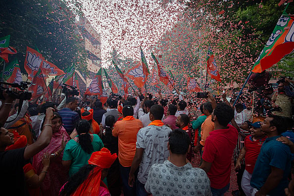 Abhishek Chinnappa via Getty :  Supporters of the Bharatiya Janata Party (BJP) celebrate election results on June 04, 2024 in Bengaluru,