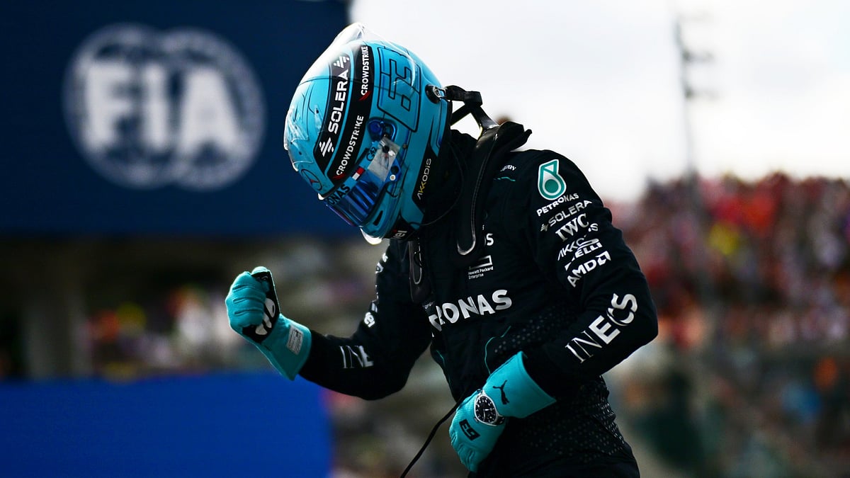 George Russell celebrates taking pole.