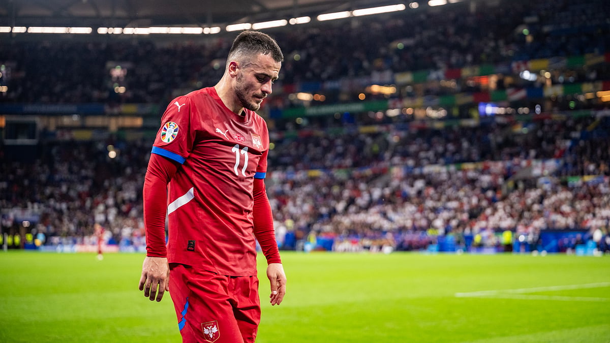Filip Kostic looks dejected after being substituted against England. - null