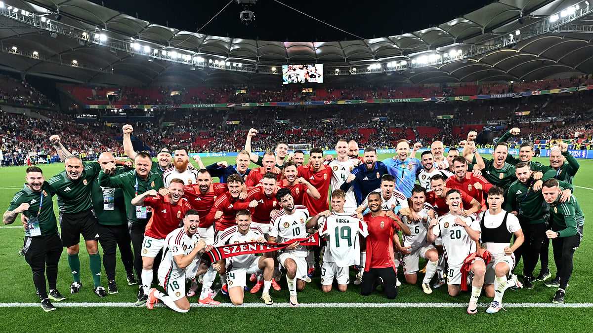Hungary's players held up Barnabas Varga's shirt after their win over Scotland. - null