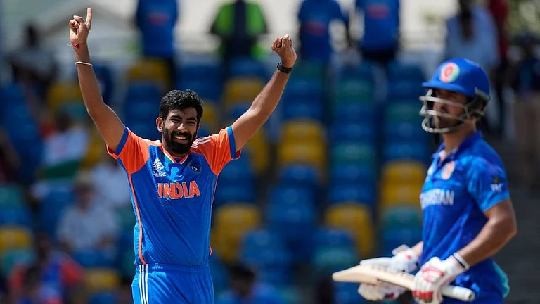 India's Jasprit Bumrah, left, celebrates the dismissal of Afghanistan's Najibullah Zadran during the ICC Men's T20 World Cup cricket match between Afghanistan and India at Kensington Oval in Bridgetown, Barbados, Thursday, June 20, 2024. - AP/Ricardo Mazalan