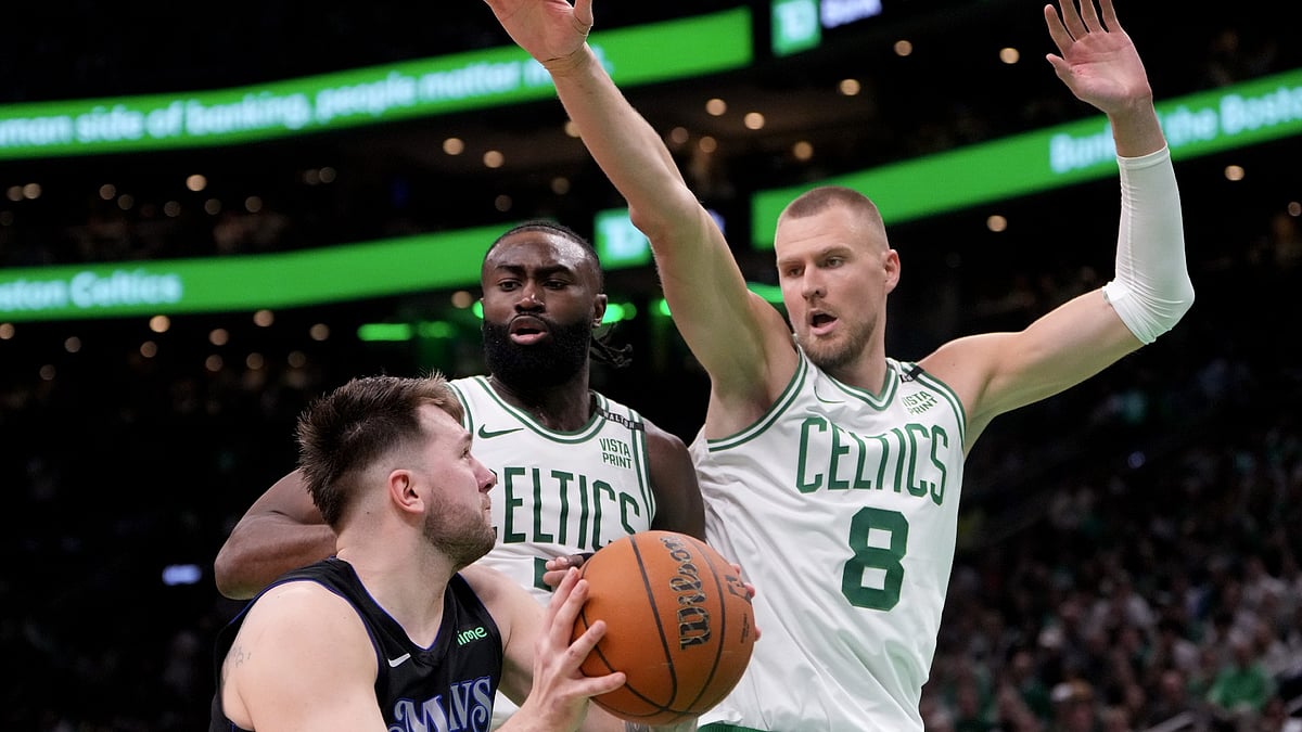 The Boston Celtics' Kristaps Porzingis is uncertain to play in Game 3 of the NBA Finals. - null