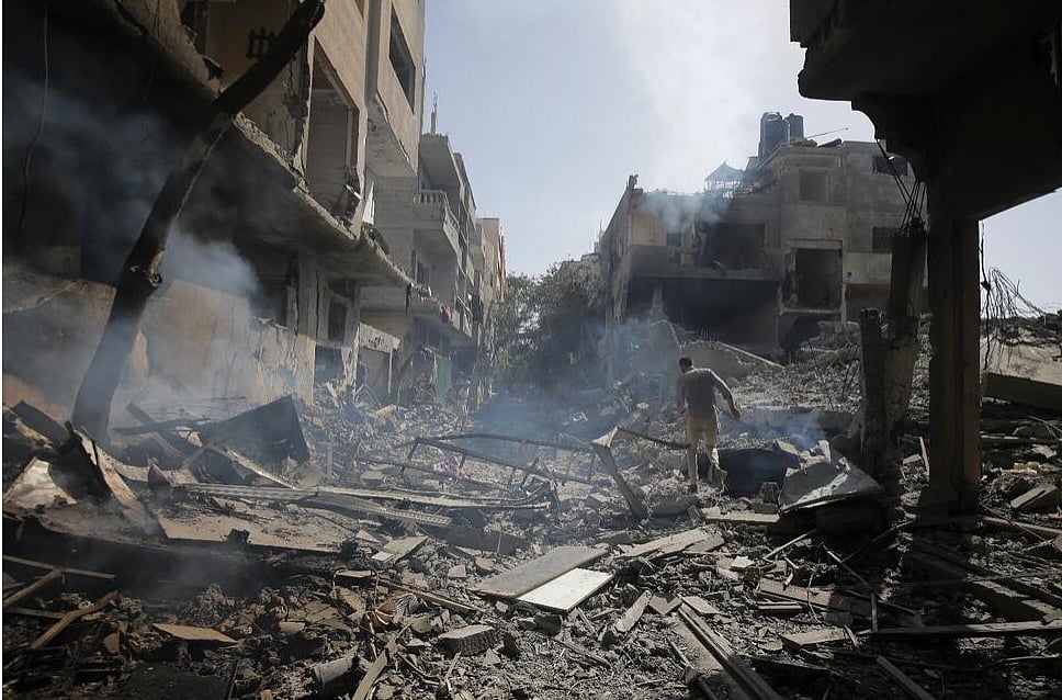AP : Palestinians look at the aftermath of the Israeli bombing in Nuseirat refugee camp, Gaza Strip, Saturday, June 8, 2024. |