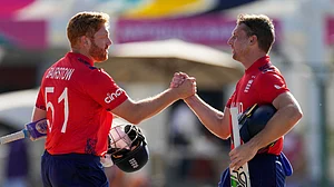 (AP Photo/Ricardo Mazalan)
: England's captain Jos Buttler, right, and batting partner Jonny Bairstow shake hands at the end of the ICC Men's T20 World Cup cricket match against Oman at Sir Vivian Richards Stadium in North Sound, Antigua and Barbuda, Thursday, June 13, 2024. England won by eight wickets with 101 balls remaining.