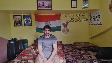 A glimpse into Aman Sehrawat's room at Chhatrasal Stadium, showcasing the personal touches that support his journey as a dedicated wrestler.