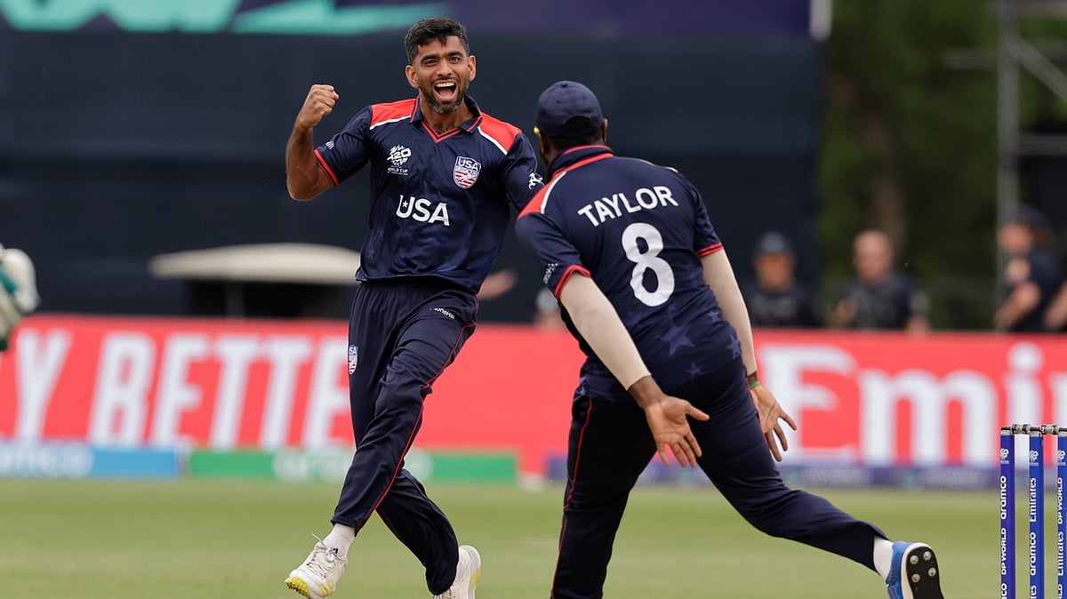 United States' Saurabh Nethralvakar, left, celebrates the dismissal of India's Virat Kohli during the ICC Men's T20 World Cup cricket match between United States and India at the Nassau County International Cricket Stadium in Westbury, New York, Wednesday, June 12, 2024. 
 - (AP Photo/Adam Hunger)