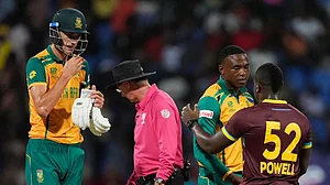 Photo: AP/Lynne Sladky : Marco Jansen (left) and Kagiso Rabada shake hands with Rovman Powell after South Africa beat West Indies by three wickets in their ICC T20 World Cup 2024, Super Eights clash in Antigua on Monday 9June 24).