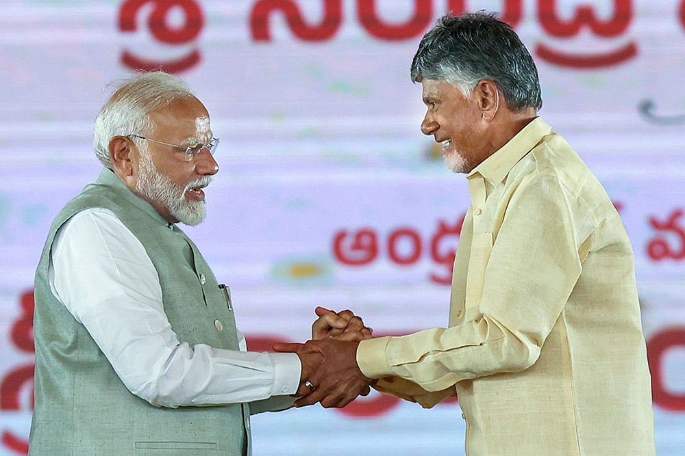 Photo: PTI : Chandrababu Naidu with PM Modi