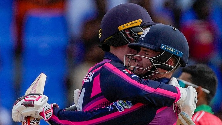 Scotland celebrate their victory over Oman - AP