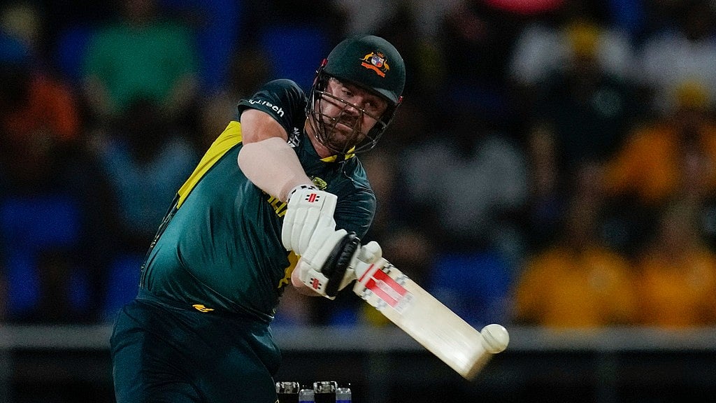 Photo: AP/Ricardo Mazalan : Travis Head bats during the Australia vs Namibia match at ICC T20 World Cup 2024 in Antigua. 