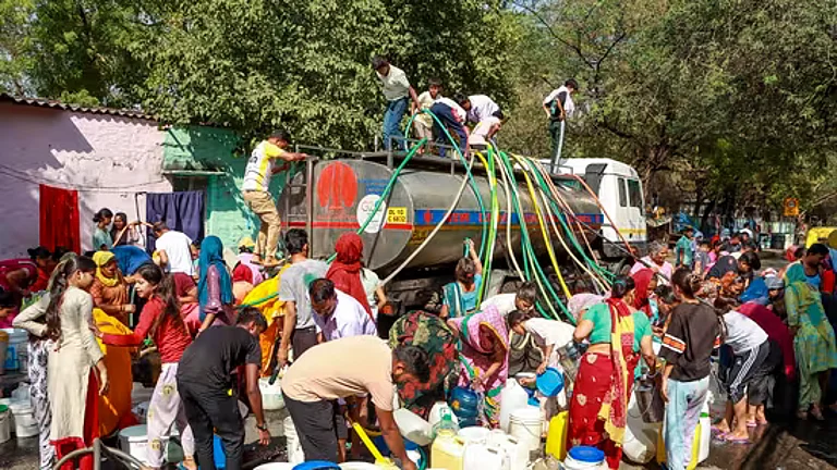 Water being distributed from a tanker in Delhi | - PTI