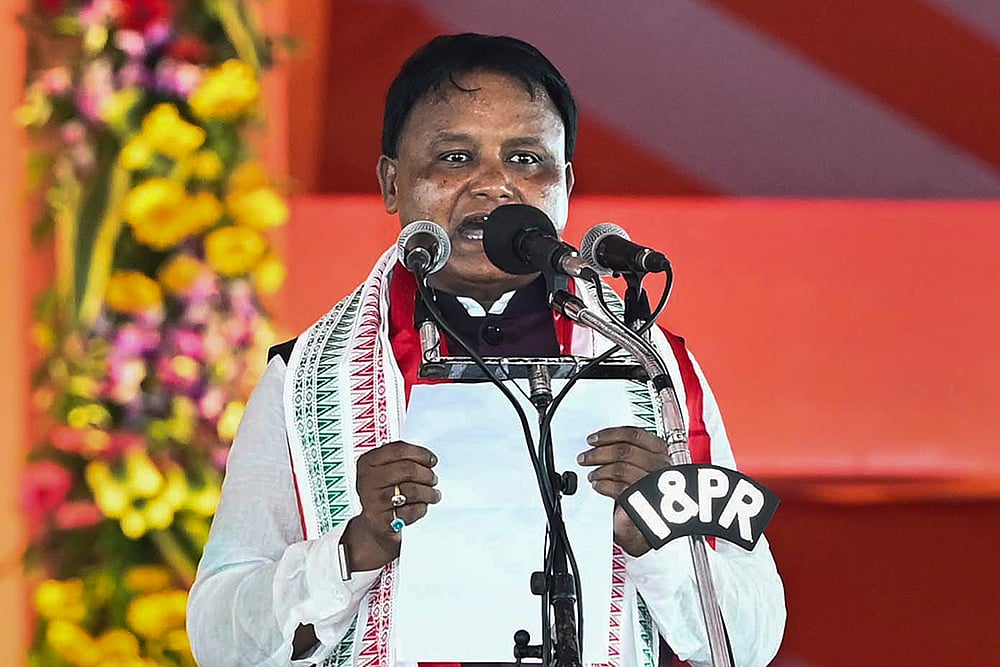 | Photo: PTI : Mohan Charan Majhi takes oath