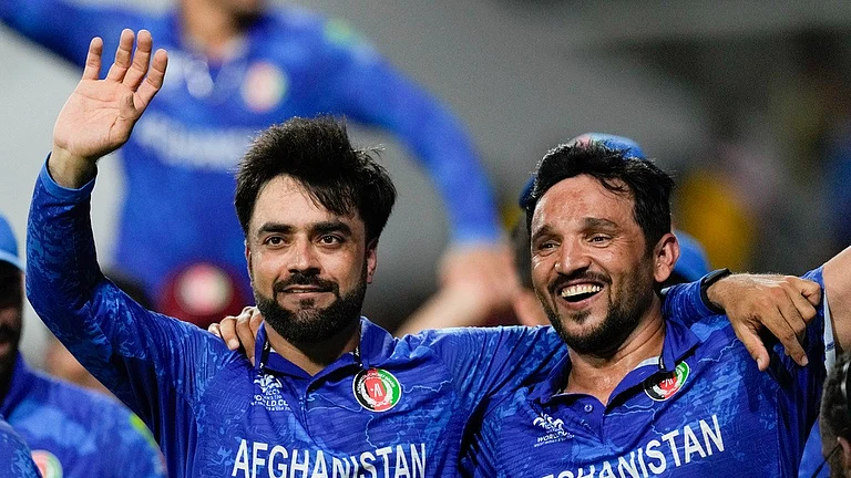 Rashid Khan (left) and Gulbadin Naib celebrate Afghanistan's win over Bangladesh and their semi-final berth at ICC T20 World Cup 2024, in Saint Vincent on Tuesday (June 25). - AP/Ricardo Mazalan