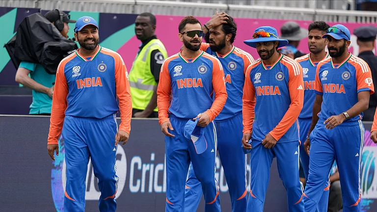 India's captain Rohit Sharma, left, leads his team to the field at the Nassau County International Cricket Stadium. - File