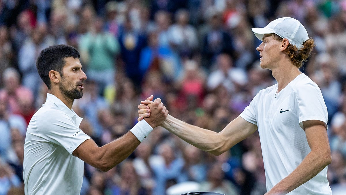 Novak Djokovic and Jannik Sinner during the Wimbledon semi-finals last year.