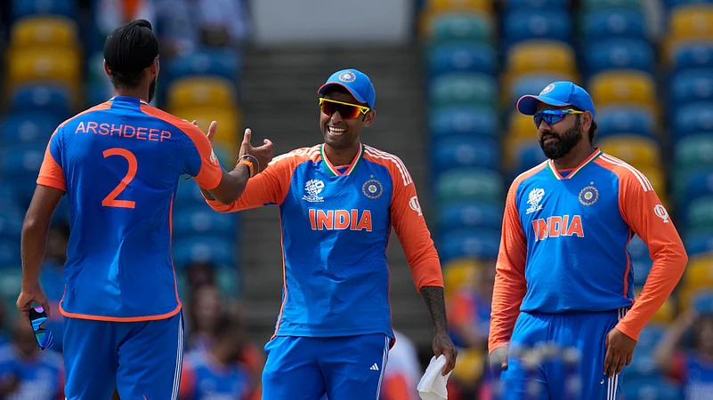 Arshdeep Singh, SKY and Rohit Sharma. AP Photo